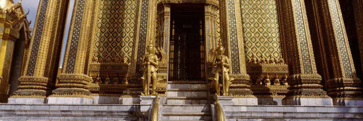 Low angle view of statues in front of a temple, Phra Mondop, Grand Palace, Bangkok, Thailand