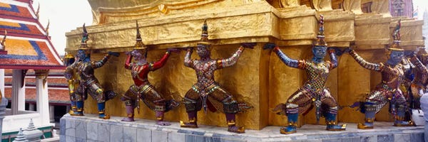 Thailand: Statues at base of golden chedi, The Grand Palace, Bangkok, Thailand by Panoramic Images