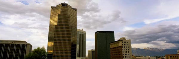 Tucson: Buildings in a city with mountains in the background, Tucson, Arizona, USA by Panoramic Images