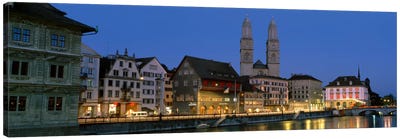 Buildings at the waterfront, Grossmunster Cathedral, Zurich, Switzerland Canvas Art Print - Night Sky Art