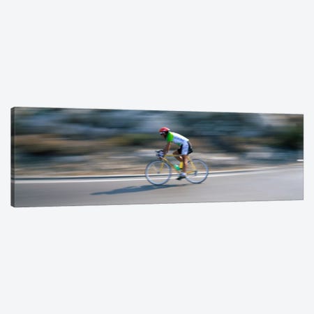 Bike racer participating in a bicycle raceSitges, Barcelona, Catalonia, Spain Canvas Print #PIM2137} by Panoramic Images Canvas Artwork