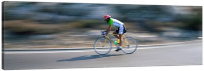 Bike racer participating in a bicycle raceSitges, Barcelona, Catalonia, Spain Canvas Art Print - Catalonia Art