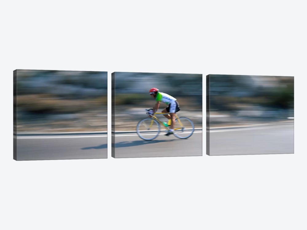 Bike racer participating in a bicycle raceSitges, Barcelona, Catalonia, Spain by Panoramic Images 3-piece Canvas Art Print