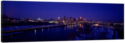 Reflection of buildings in a river at nightMississippi River, Minneapolis & St Paul, Minnesota, USA Canvas Art Print