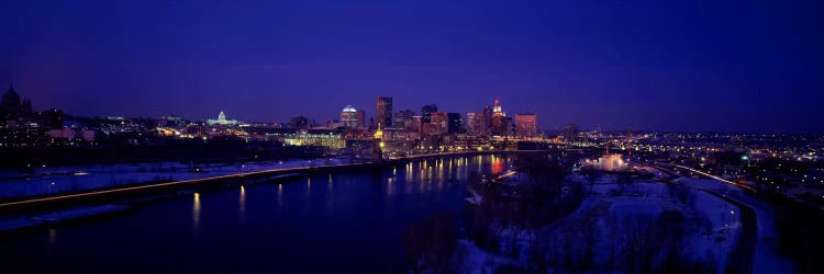 Reflection of buildings in a river at nightMississippi River, Minneapolis & St Paul, Minnesota, USA