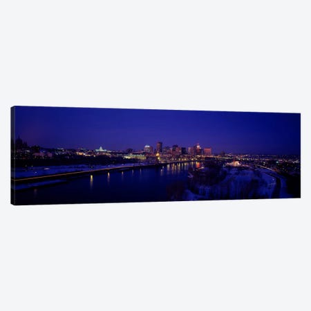 Reflection of buildings in a river at nightMississippi River, Minneapolis & St Paul, Minnesota, USA Canvas Print #PIM2174} by Panoramic Images Canvas Art