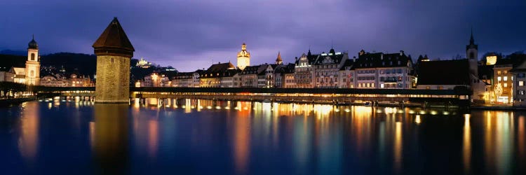 Buildings lit up at dusk, Chapel Bridge, Reuss River, Lucerne, Switzerland