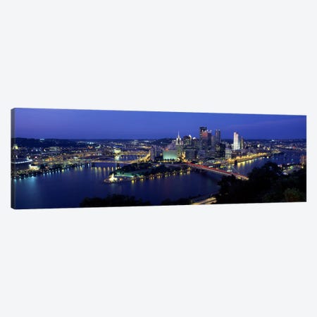 Buildings along a river lit up at dusk, Monongahela River, Pittsburgh, Allegheny County, Pennsylvania, USA Canvas Print #PIM2219} by Panoramic Images Canvas Wall Art