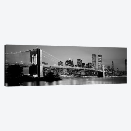 Illuminated Brooklyn Bridge With Lower Manhattan's Financial District Skyline In The Background In B&W, New York City, New York  Canvas Print #PIM2259bw} by Panoramic Images Canvas Art