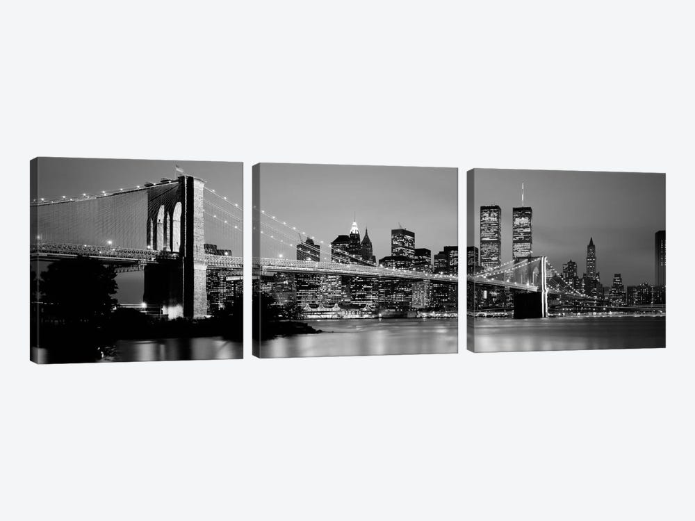 Illuminated Brooklyn Bridge With Lower Manhattan's Financial District Skyline In The Background In B&W, New York City, New York  by Panoramic Images 3-piece Canvas Wall Art