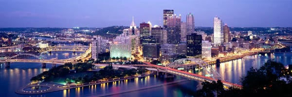 Pennsylvania: Buildings in a city lit up at dusk, Pittsburgh, Allegheny County, Pennsylvania, USA by Panoramic Images