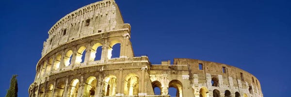 Ancient Ruins: Low angle view of ruins of an amphitheaterColiseum, Rome, Lazio, Italy by Panoramic Images