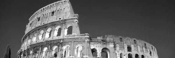 Wonders Of The World: Low angle view of ruins of an amphitheater, Coliseum, Rome, Lazio, Italy (black & white) by Panoramic Images