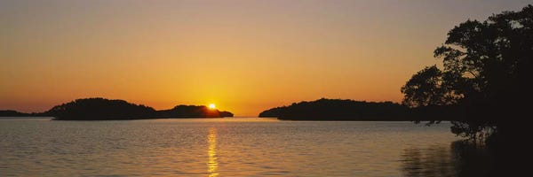 Mountain Sunrises & Sunsets: Refection of sun in waterEverglades National Park, Miami, Florida, USA by Panoramic Images