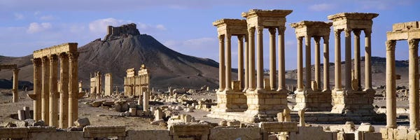 Columns: The Tetrapylon Of The Great Colonnade With A Distant View Of Fakhr-al-Din al-Ma'ani Castle, Palmyra, Homs Governorate, Syria by Panoramic Images