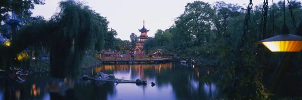 Buddhism: Pagoda lit up at dusk, Tivoli Gardens, Copenhagen, Denmark by Panoramic Images