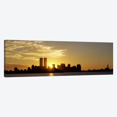 Manhattan skyline & a statue at sunrise Statue of Liberty, New York City, New York State, USA Canvas Print #PIM2640} by Panoramic Images Art Print