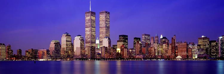 Buildings at the waterfront lit up at dusk, World Trade Center, Wall Street, Manhattan, New York City, New York State, USA