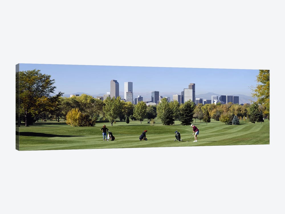 Four people playing golf with buildings in the background, Denver, Colorado, USA by Panoramic Images 1-piece Canvas Art Print