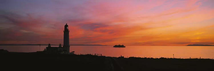 Silhouette of a lighthouse at sunset, Scotland