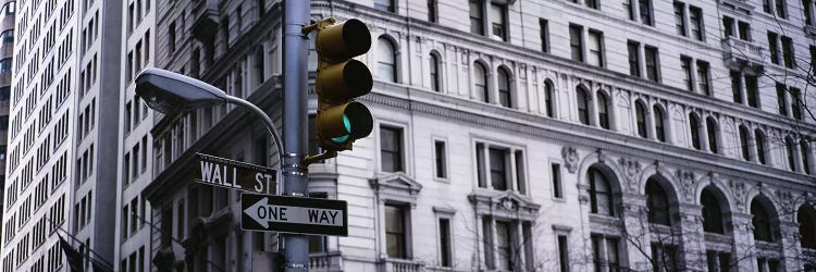 Low angle view of a traffic light in front of a buildingWall Street, New York City, New York State, USA by Panoramic Images wall art