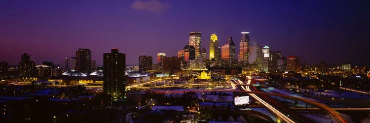 Skyscrapers lit up at duskMinneapolis, Minnesota, USA by Panoramic Images wall art