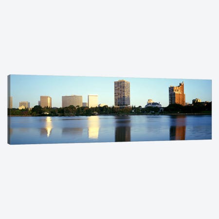 Reflection Of Skyscrapers In A Lake, Lake Merritt, Oakland, California, USA Canvas Print #PIM2894} by Panoramic Images Canvas Art Print