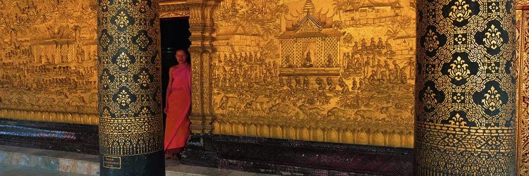 Monk in prayer hall at Wat Mai Buddhist Monastery, Luang Prabang, Laos