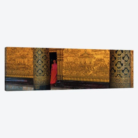 Monk in prayer hall at Wat Mai Buddhist Monastery, Luang Prabang, Laos Canvas Print #PIM2906} by Panoramic Images Canvas Art Print