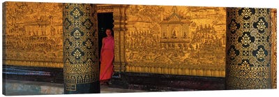 Monk in prayer hall at Wat Mai Buddhist Monastery, Luang Prabang, Laos Canvas Art Print - Column Art
