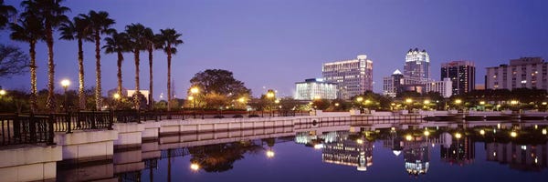 Orlando: Reflection Of Buildings In The Lake, Lake Luceme, Orlando, Florida, USA by Panoramic Images