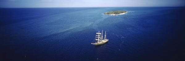 Islands: High angle view of a sailboat in the ocean, Heron Island, Great Barrier Reef, Queensland, Australia by Panoramic Images
