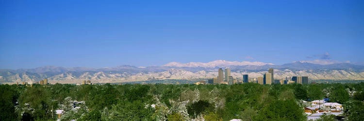 Buildings in a city with a mountain range in the background, Denver, Colorado, USA