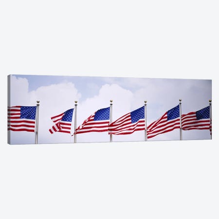 Low angle view of American flags fluttering in wind Canvas Print #PIM3005} by Panoramic Images Canvas Art Print