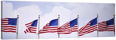 Low angle view of American flags fluttering in wind Canvas Art Print - American Flag Art