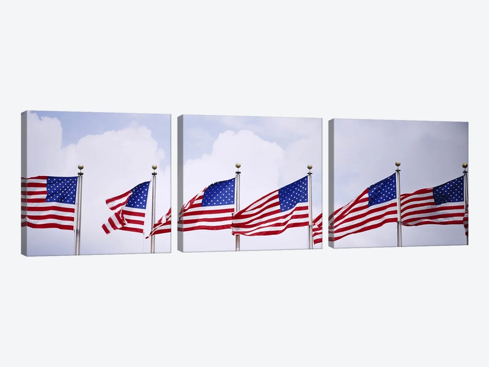 Low angle view of American flags fluttering in wind by Panoramic Images 3-piece Canvas Print