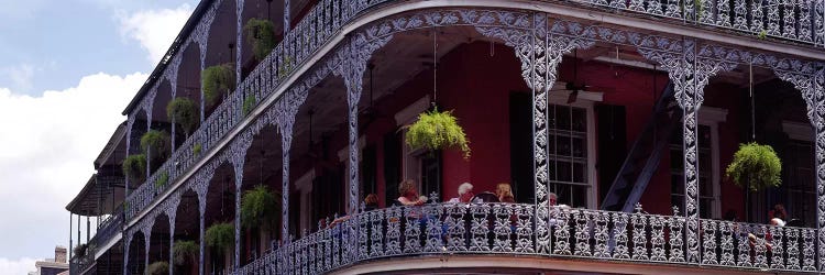 People sitting in a balcony, French Quarter, New Orleans, Louisiana, USA