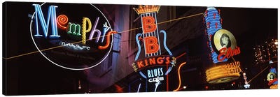 Low angle view of neon signs lit up at night, Beale Street, Memphis, Tennessee, USA Canvas Art Print - Musical Instrument Art
