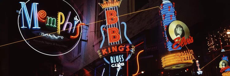 Low angle view of neon signs lit up at night, Beale Street, Memphis, Tennessee, USA