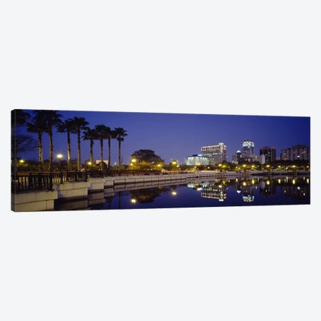 Reflection of buildings in water, Orlando, Florida, USA Canvas Print #PIM3062} by Panoramic Images Canvas Wall Art