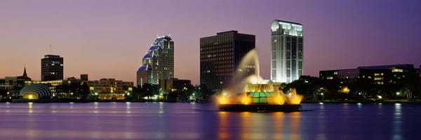 Fountains: Fountain in a lake lit up at night, Lake Eola, Summerlin Park, Orlando, Orange County, Florida, USA by Panoramic Images
