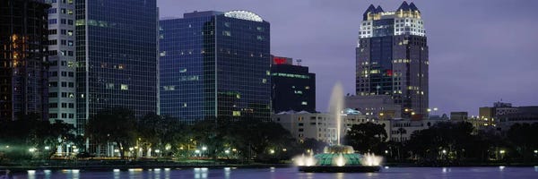 Orlando: Fountain in a lake lit up at night, Lake Eola, Summerlin Park, Orlando, Orange County, Florida, USA #2 by Panoramic Images