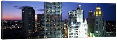 Skyscraper lit up at night in a city, Chicago, Illinois, USA Canvas Art Print - Chicago Skylines