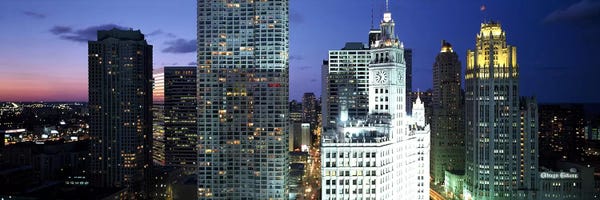 Chicago Skylines: Skyscraper lit up at night in a city, Chicago, Illinois, USA by Panoramic Images
