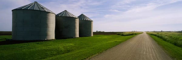 Three silos in a field