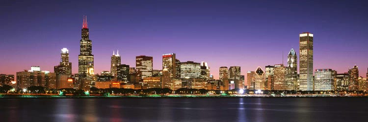 Skyscrapers lit up at night at the waterfront, Lake Michigan, Chicago, Cook County, Illinois, USA