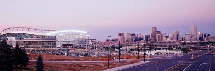 USA, Colorado, Denver, Invesco Stadium, Skyline at dusk