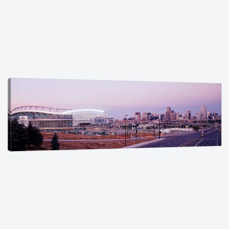 USA, Colorado, Denver, Invesco Stadium, Skyline at dusk Canvas Print #PIM3322} by Panoramic Images Canvas Art Print