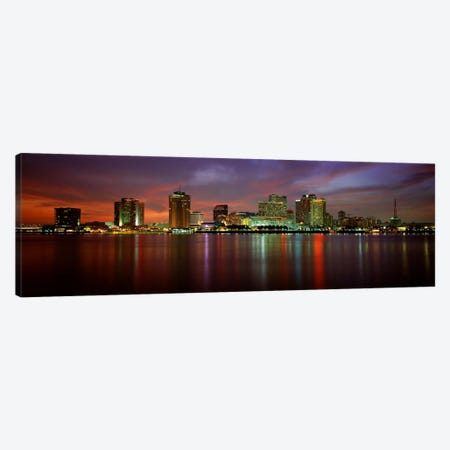 Buildings lit up at the waterfront, New Orleans, Louisiana, USA Canvas Print #PIM3334} by Panoramic Images Canvas Print