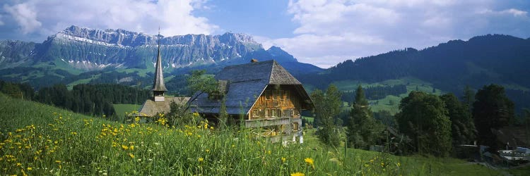 Chalet and a church on a landscape, Emmental, Switzerland